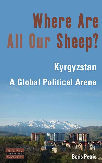 书封，天蓝背景下雪山连绵、山脚是城镇楼群，书名《Where Are All Our Sheep?》以赭红色大字印于上方，副标题为白色小字。